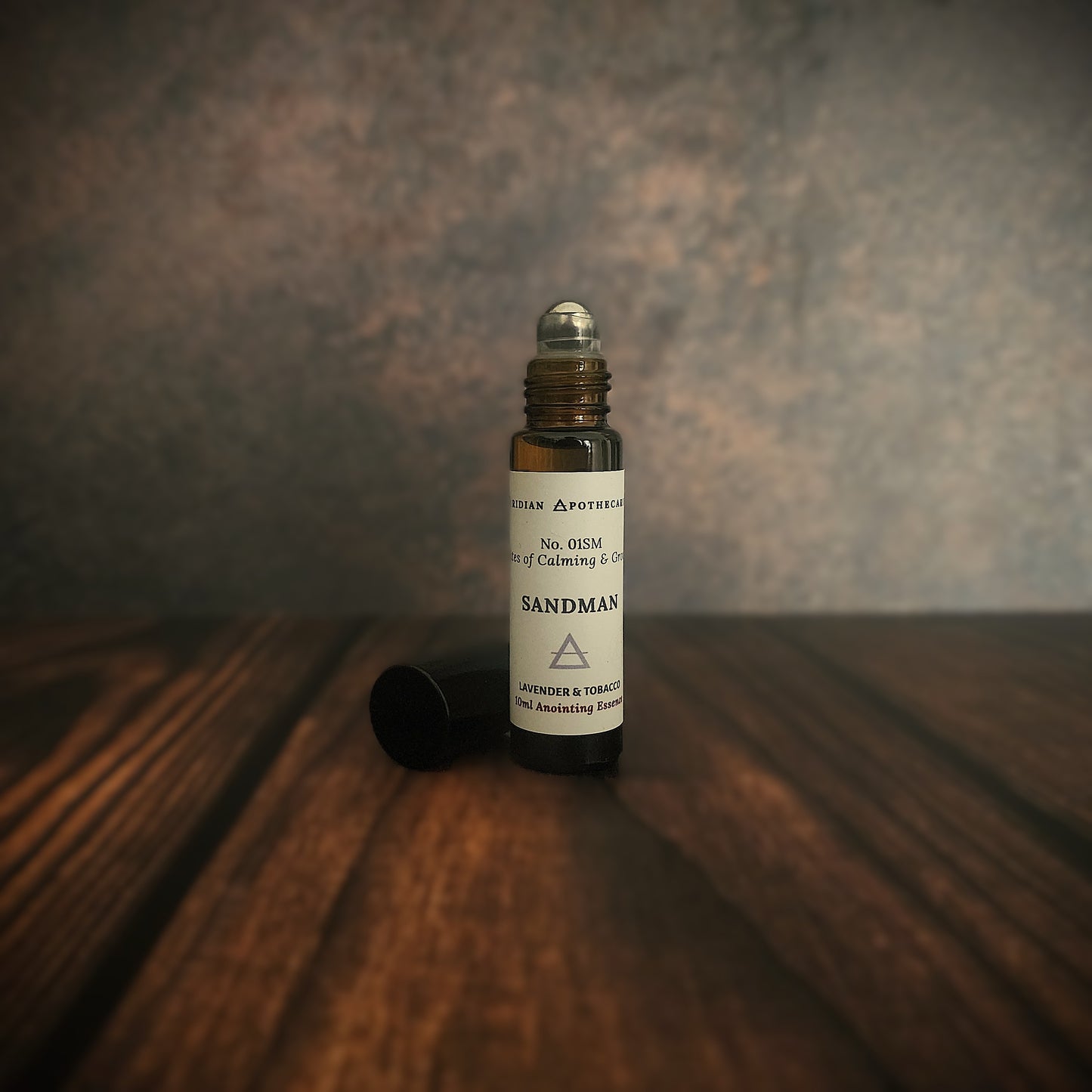 Sandman Essence - Perfume Roll-On bottle for calming and grounding blends of lavender, bergamot, and vanilla, by Viridian Candle Co. Fragrance oil roll-on inspired by fantasy.