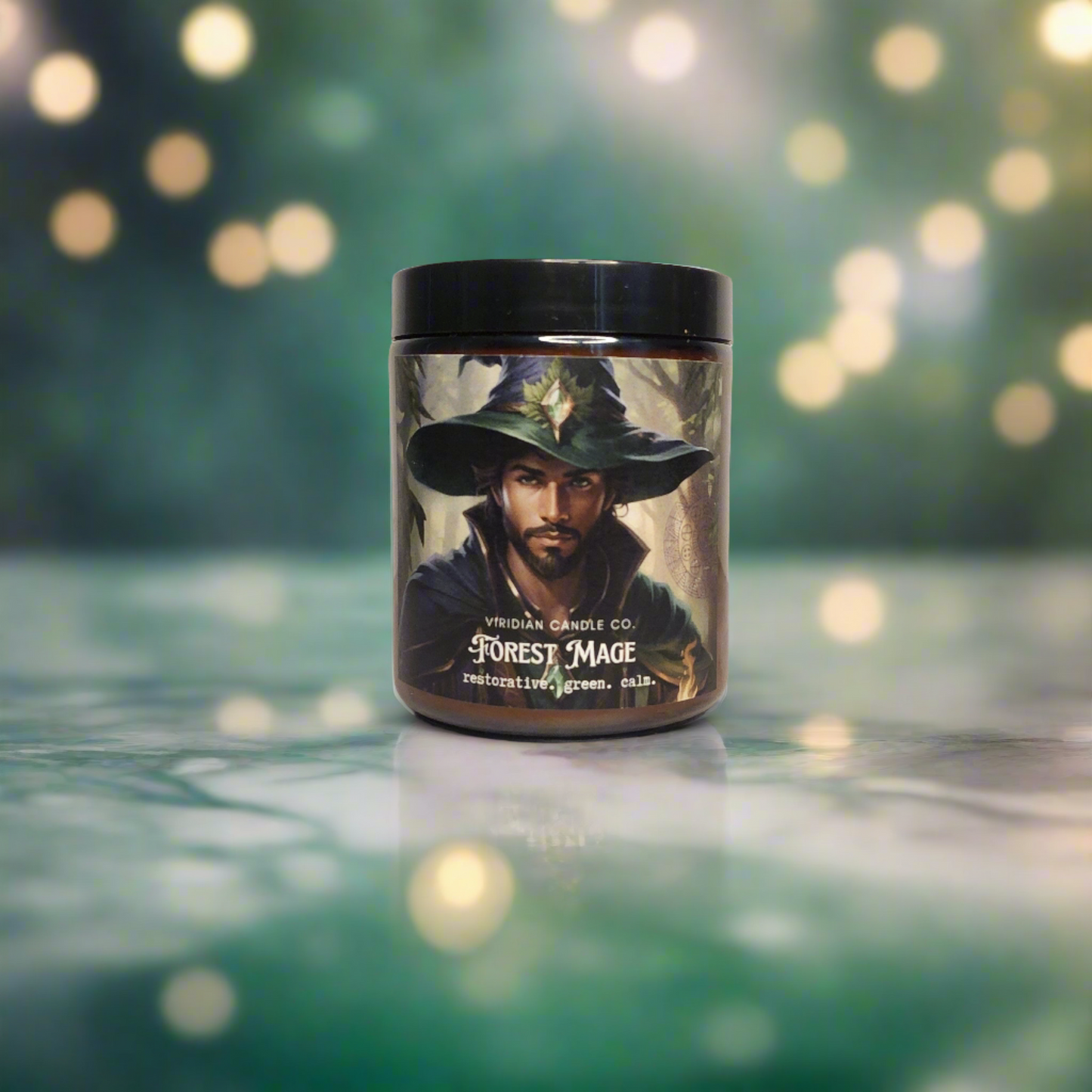 Forest Mage soy fantasy candle, by Viridian Candle Co. on a green marble surface with fairy lights in the background.