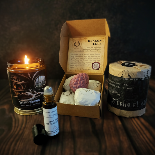 Dragon’s Hoard fantasy gift bundle featuring artisan candles, dragon egg decor and amber glass essence.