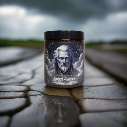 a Stormfather candle, handcrafted by Viridian Candle Co., on a cobblestone road, with a storm brewing in the bakground. Inspired by epic fantasy, Brandon Sanderson's Stormlight Archives.