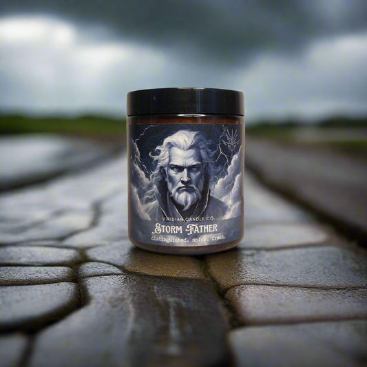 a Stormfather candle, handcrafted by Viridian Candle Co., on a cobblestone road, with a storm brewing in the bakground. Inspired by epic fantasy, Brandon Sanderson's Stormlight Archives.