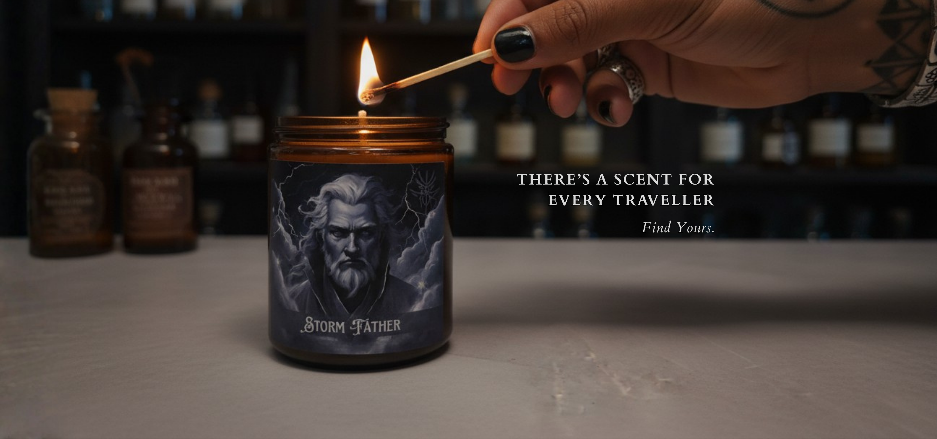 Candle with a label 'Storm Father' being lit, with text 'There's a scent for every traveller. Find yours.' in a moody modern apothecary setting.